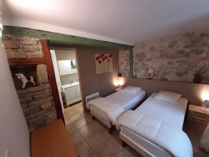 Ένα ή περισσότερα κρεβάτια σε δωμάτιο στο Pommayrac nature