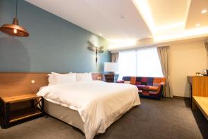 Letto o letti in una camera di Walker Hotel. Ximen