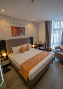 Postel nebo postele na pokoji v ubytování Baraka Tower Hotel