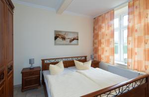Ένα ή περισσότερα κρεβάτια σε δωμάτιο στο WassermannApartments