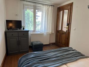 Postel nebo postele na pokoji v ubytování Klecherova House