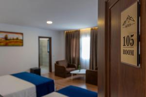 Katil atau katil-katil dalam bilik di Acros Resort