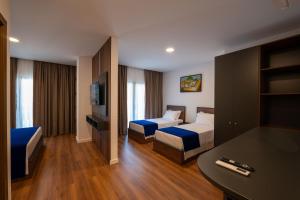 Katil atau katil-katil dalam bilik di Acros Resort