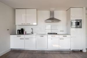 Η κουζίνα ή μικρή κουζίνα στο Amsterdam Centre Harbour Apartments +39 φωτογραφίες