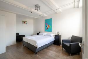 Ένα ή περισσότερα κρεβάτια σε δωμάτιο στο Amsterdam Centre Harbour Apartments