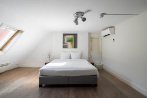 Ένα ή περισσότερα κρεβάτια σε δωμάτιο στο Amsterdam Centre Harbour Apartments