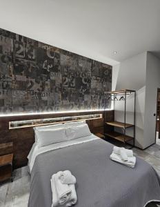 Postel nebo postele na pokoji v ubytování Binario1 Rooms