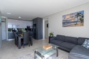 a living room with a couch and a table at 8 at Bella Mare Estate in Gqeberha