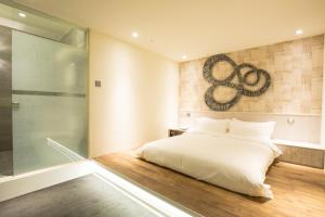 Letto o letti in una camera di Walker Hotel. Ximen