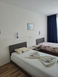 Postel nebo postele na pokoji v ubytování Complex Astra