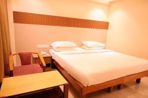 Postel nebo postele na pokoji v ubytování Hotel Surguru