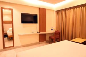 TV a/nebo společenská místnost v ubytování Hotel Surguru