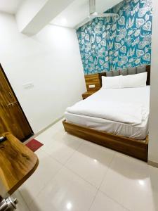 Katil atau katil-katil dalam bilik di HOTEL TAPOVAN IN