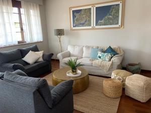 a living room with couches and a coffee table at Casa Donato in Narón +52 photos
