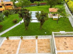 an aerial view of a garden with palm trees at Casa Donato in Narón