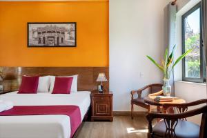 Postel nebo postele na pokoji v ubytování Laughter garden