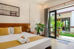 Postel nebo postele na pokoji v ubytování Laughter garden