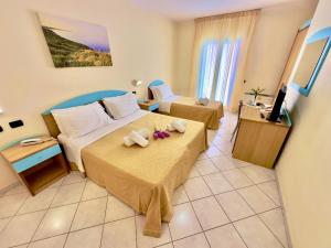 Postel nebo postele na pokoji v ubytování Hotel Alizé