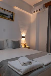 Postel nebo postele na pokoji v ubytování Apart Hotel Alex