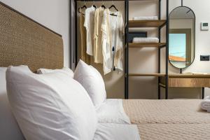 Giường trong phòng chung tại Hotel Papillon