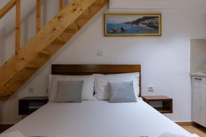 Postel nebo postele na pokoji v ubytování Apart Hotel Alex