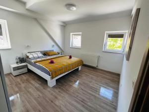 Postel nebo postele na pokoji v ubytování Apartmani LU&LO