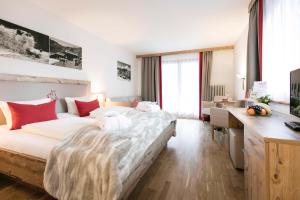 Posteľ alebo postele v izbe v ubytovaní Sporthotel by Alpenlodge