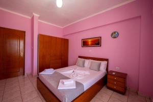 Postel nebo postele na pokoji v ubytování Apart Hotel Alex