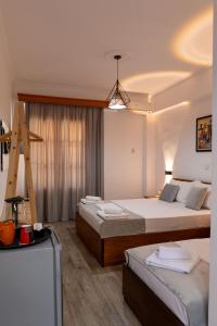 Postel nebo postele na pokoji v ubytování Apart Hotel Alex