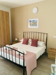 Postel nebo postele na pokoji v ubytování B&B Le Grazie