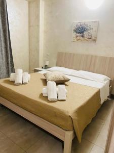 Postel nebo postele na pokoji v ubytování B&B Le Grazie