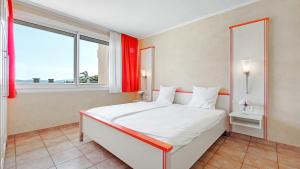 Cama ou camas em um quarto em Résidence les Tourelles