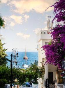 a view of the ocean with a boat in the water at Saint 40 Suites Premium Flat in Sarandë