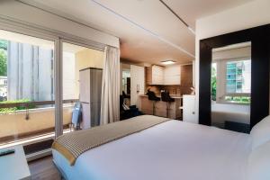 A bed or beds in a room at Terrazza Paradiso 2 by Quokka 360 - Studio with Balcony