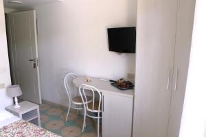 TV a/nebo společenská místnost v ubytování Residence delle Nazioni + 37 fotografií