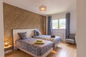 En eller flere senge i et værelse på Eden Lac et Montagnes