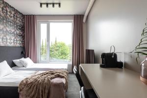 Postel nebo postele na pokoji v ubytování Hugo Apartment Hotel + 37 fotografií