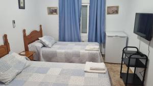 Postel nebo postele na pokoji v ubytování HABITACIONES LOS CAÑOS + 26 fotografií