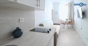 a living room with a couch and a table at VILLA SEPHORA CANNES in Cannes +161 photos