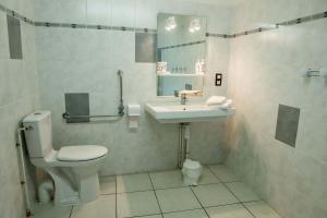 a bathroom with a toilet and a sink at Gites de france 3 epis 8 personnes a malbouzon in Malbouzon +13 photos