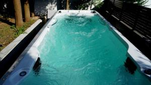 a pool of blue water in a bath tub at Villa Panthera in Dramalj