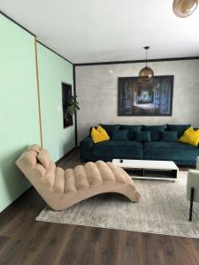 a living room with a couch and a living room with at Apartments Sabo in Kraljevica