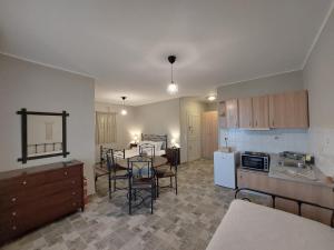 a kitchen and dining room with a table and chairs at Paesino in Kionia +43 photos