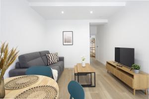 Μια τηλεόραση ή/και κέντρο ψυχαγωγίας στο Apartamentos Turísticos D10