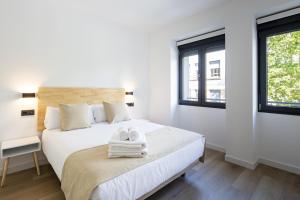 Ένα ή περισσότερα κρεβάτια σε δωμάτιο στο Apartamentos Turísticos D10