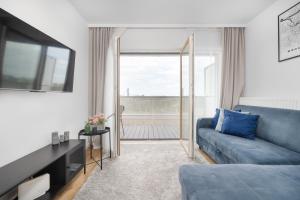 Posedenie v ubytovaní Klasyczny Apartament z Balkonem we Wrocławiu by Noclegi Renters
