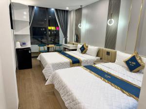 Postel nebo postele na pokoji v ubytování Phi Hùng Hotel