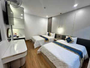 Postel nebo postele na pokoji v ubytování Phi Hùng Hotel