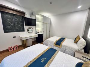 Postel nebo postele na pokoji v ubytování Phi Hùng Hotel