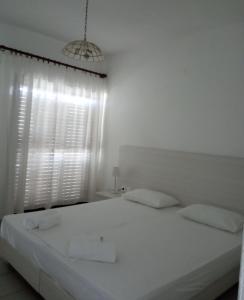 Cama ou camas em um quarto em Villa Frideriki